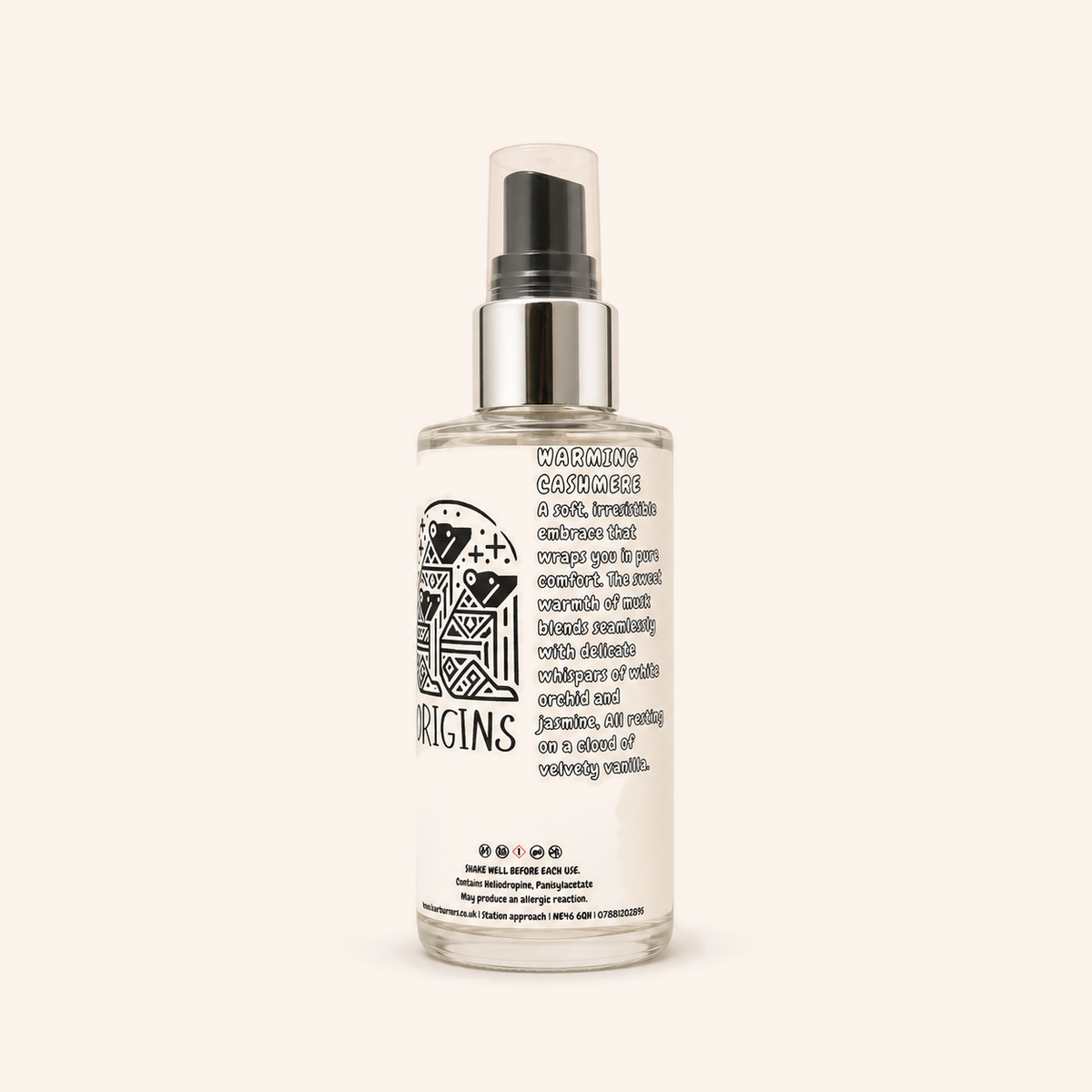 Origins room spray in a clear bottle with a black spray pump and printed label.