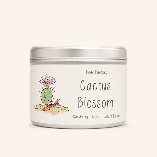 Cactus Blossom candle in a silver lidded tin with an illustrated cream label.