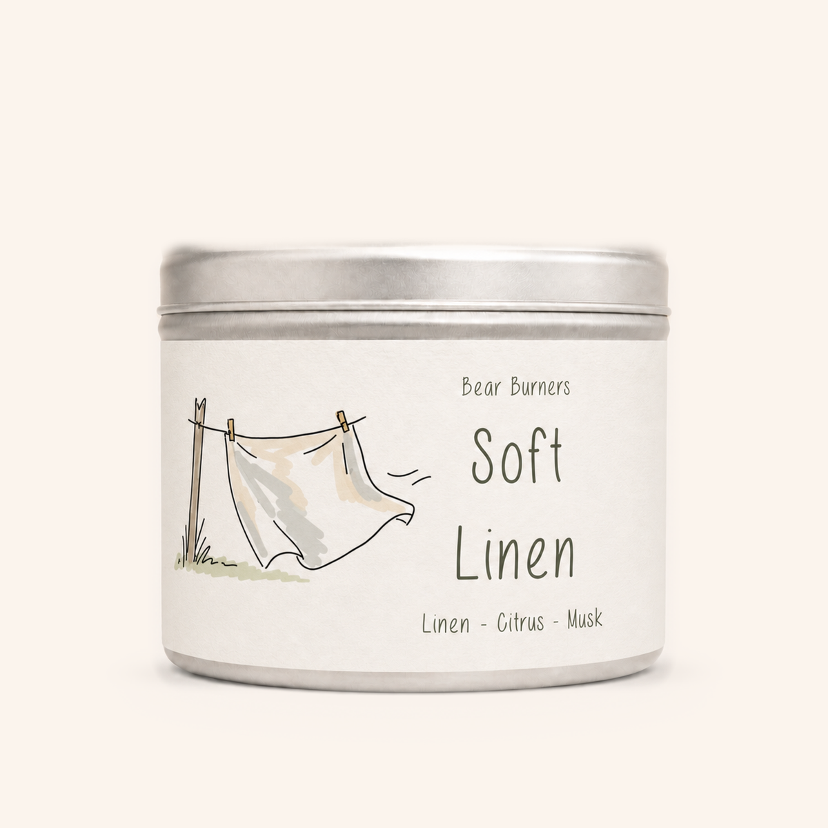 Soft Linen candle in a silver lidded tin with an illustrated cream label.