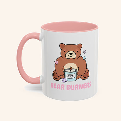 White Bear Burners mug with a pink handle and interior and a bear illustration.