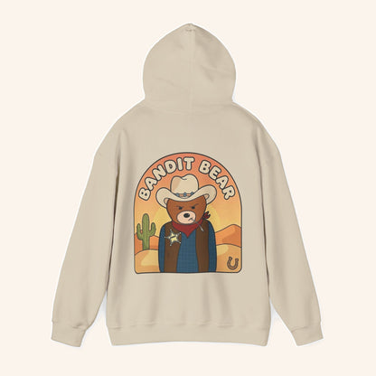 Rear view of the cream Bandit Bear hoodie and cowboy artwork.