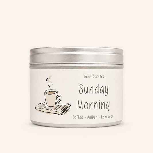 Sunday Morning candle in a silver lidded tin with an illustrated cream label.