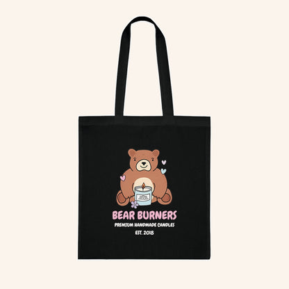 Black cotton tote bag with a Bear Burners bear and candle illustration.