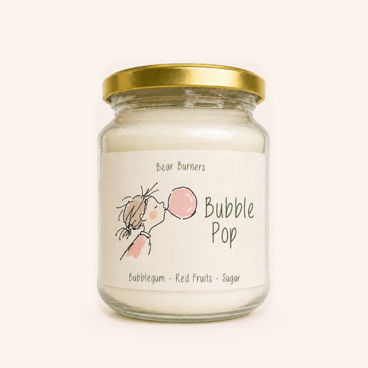 Bubble Pop candle in a clear glass jar with a gold lid and illustrated cream label.