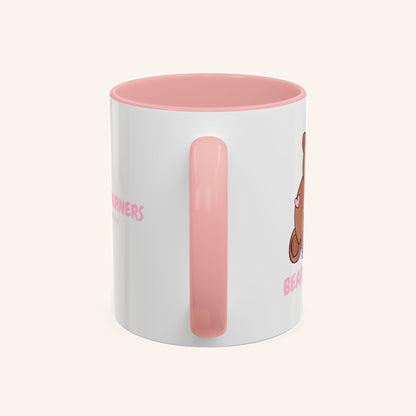 Handle-side view of the pink and white Bear Burners mug.