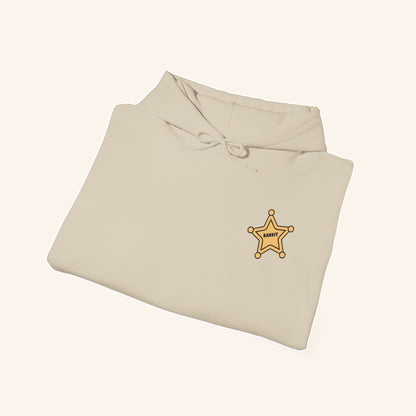 Folded cream Bandit hoodie showing the sheriff-star chest design.
