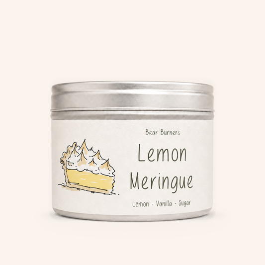Lemon Meringue candle in a silver lidded tin with an illustrated cream label.