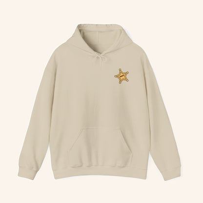 Front of a cream Bandit hoodie with a small sheriff-star chest design.