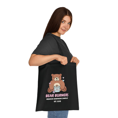 Person carrying a black Bear Burners logo tote bag.